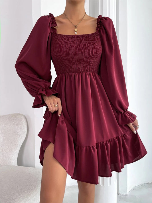 Flared dress with long sleeves and square neck